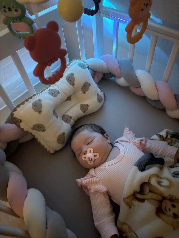 Baby sleeps peacefully in decorated crib in Beilstein