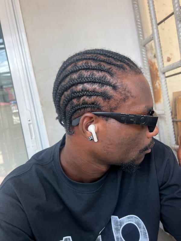 Man photographed wearing OFF sunglasses and earbuds in Ikeja