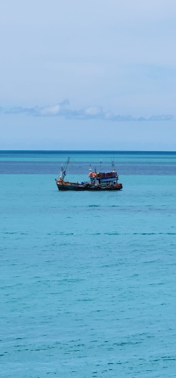 Rocky coastline and calm water at Baan Chaweng Noi, Koh Samui