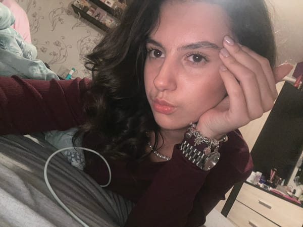 Woman rests with luxury jewelry, watch observed nearby