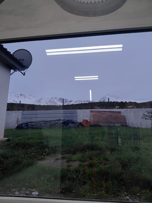 Window view of snow-capped Andes from Ushuaia building