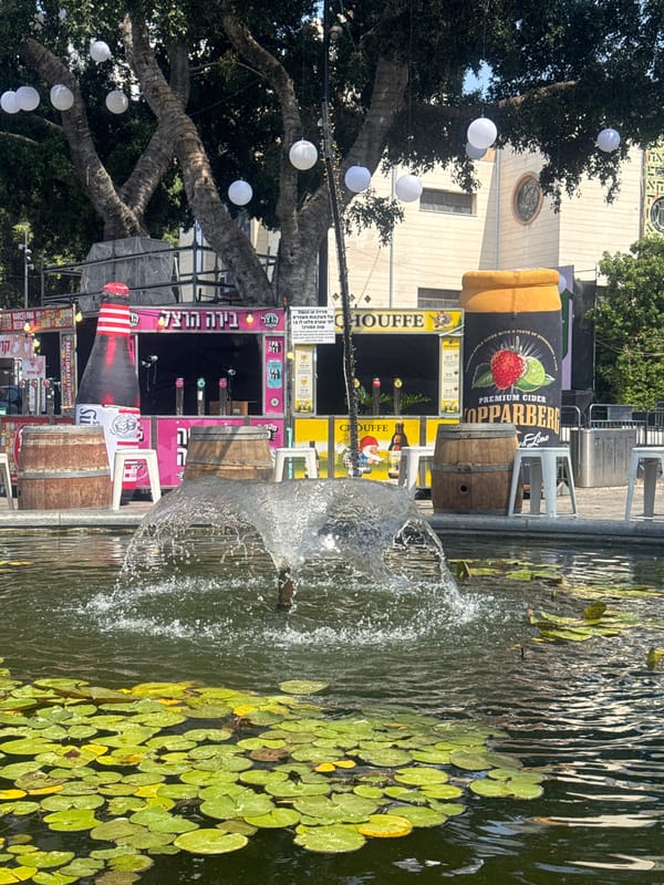 Outdoor festival in Ramat Gan with live stage and food stalls