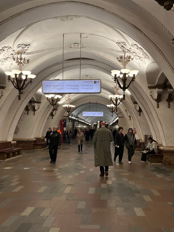 Moscow tourists document metro station and Kremlin sightseeing