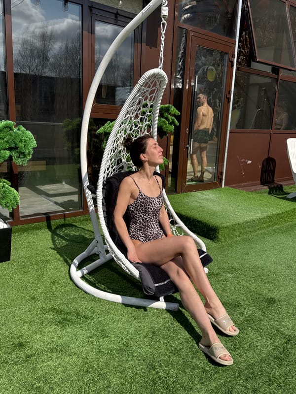 Women sunbathe on artificial turf rooftop in Votkinsk