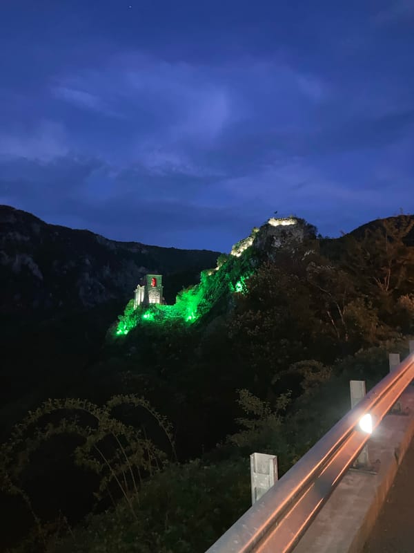 Illuminated hillside structures observed during nighttime hours
