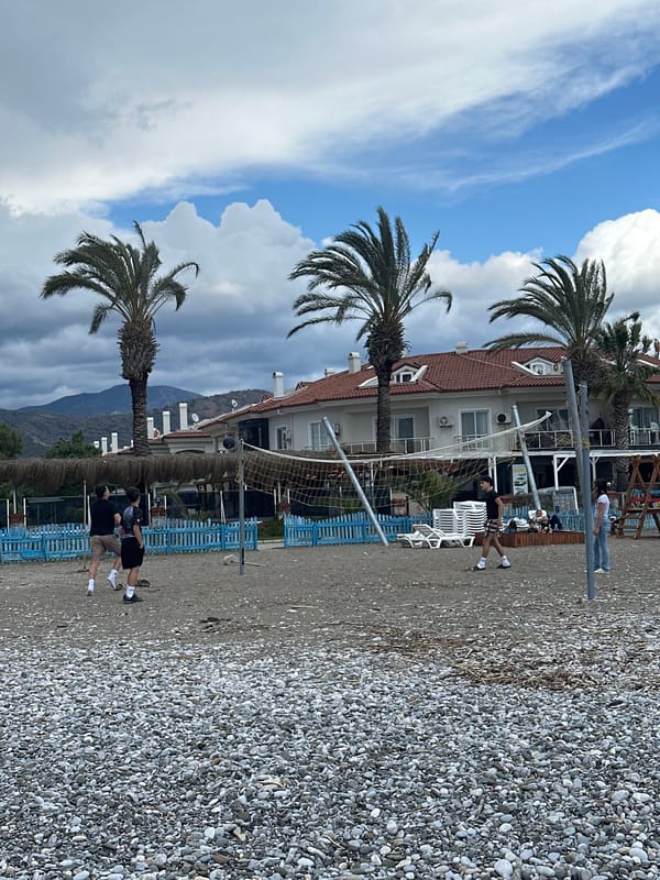 Beachgoers relax on pebble shores in Fethiye Turkey