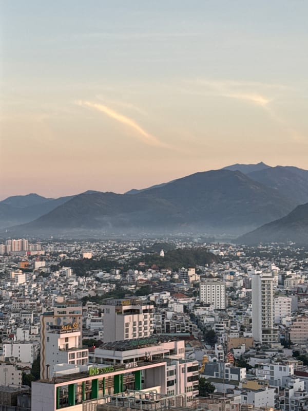 Dusk views over Nha Trang's skyline, coast, and mountains