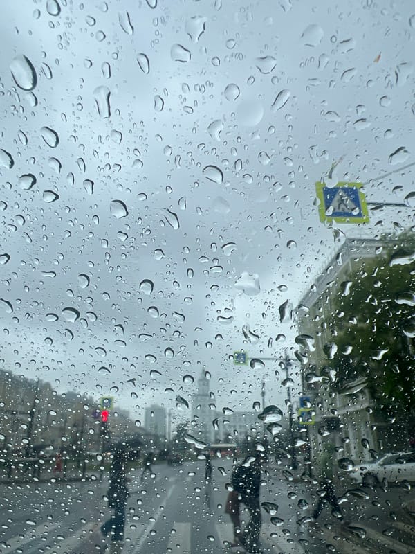 Rainy afternoon captured through car windshields in Perm, Russia