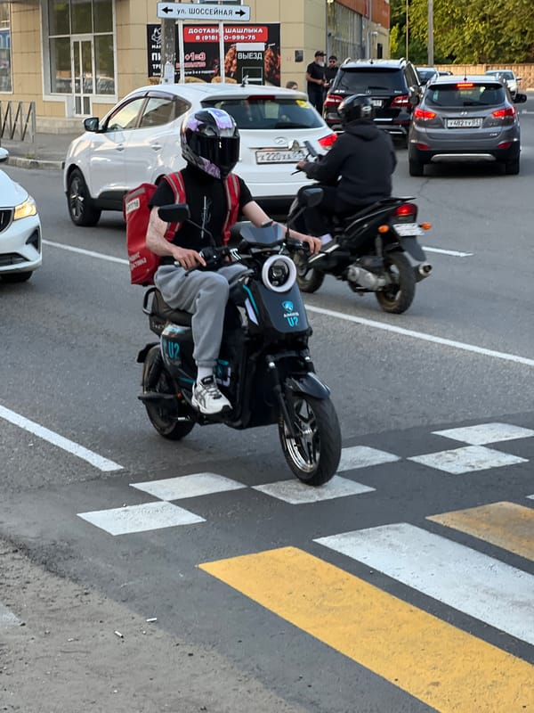 Delivery workers, pedestrians navigate busy Yablonovskiy streets
