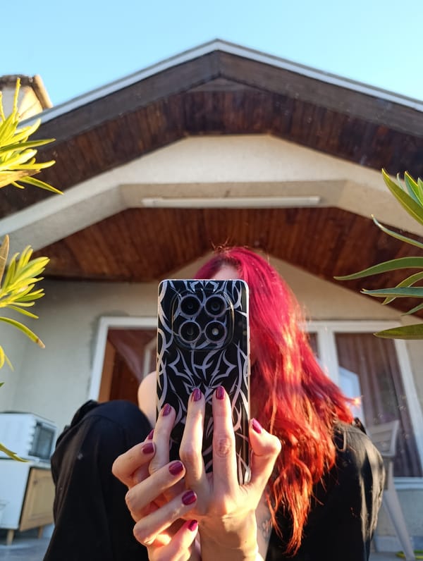 Person takes mirror selfies on balcony in Bulgarian border town