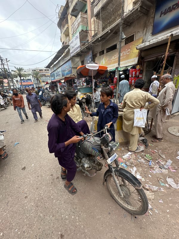 Street life and architecture in a busy Karachi marketplace