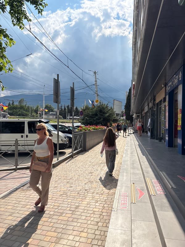 Everyday street life captured in Alushta, Ukraine midday