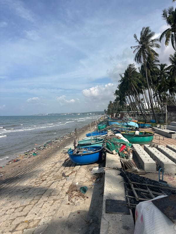 Tropical beach shoreline heavy with plastic and debris pollution