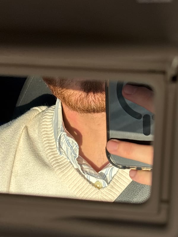 Person photographs self in car mirror, Mexico City