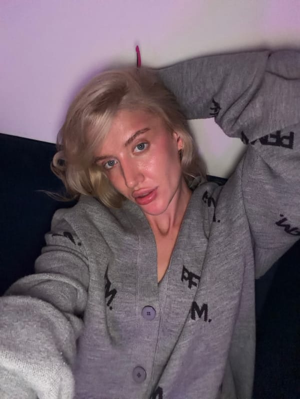 Women enjoy quiet evening at home with cat in Belgrade