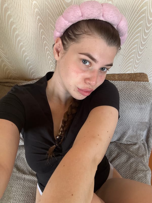 Woman documents morning skincare routine in rural Russian home