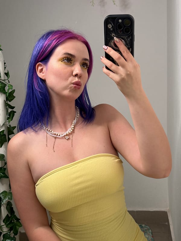 Woman takes multiple selfies in decorated Zagreb interior