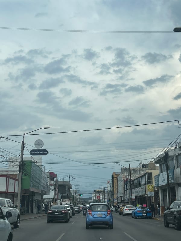 Overcast evening street scene documented in Puebla, Mexico
