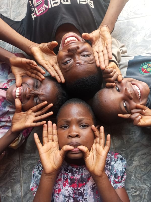Children play, man speaks in Tempure Nigeria afternoon