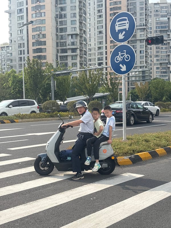 Morning street activity at a Suzhou Industrial Park intersection