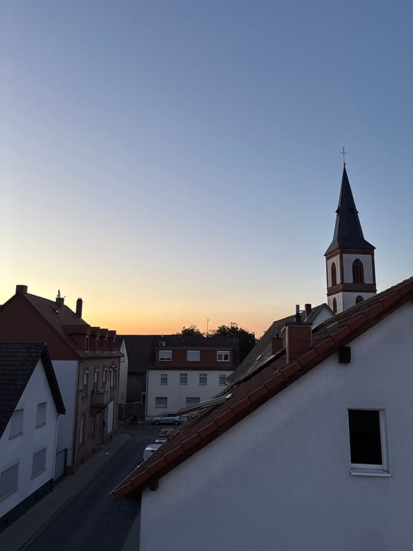 Dusk settles over Viernheim, church steeple in view