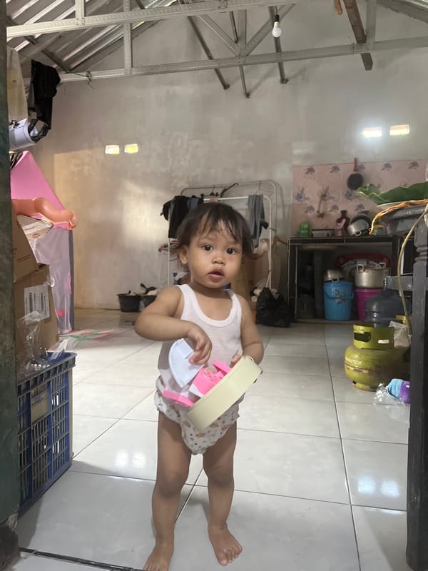 Toddler playtime at home in Kecamatan Pati, Indonesia