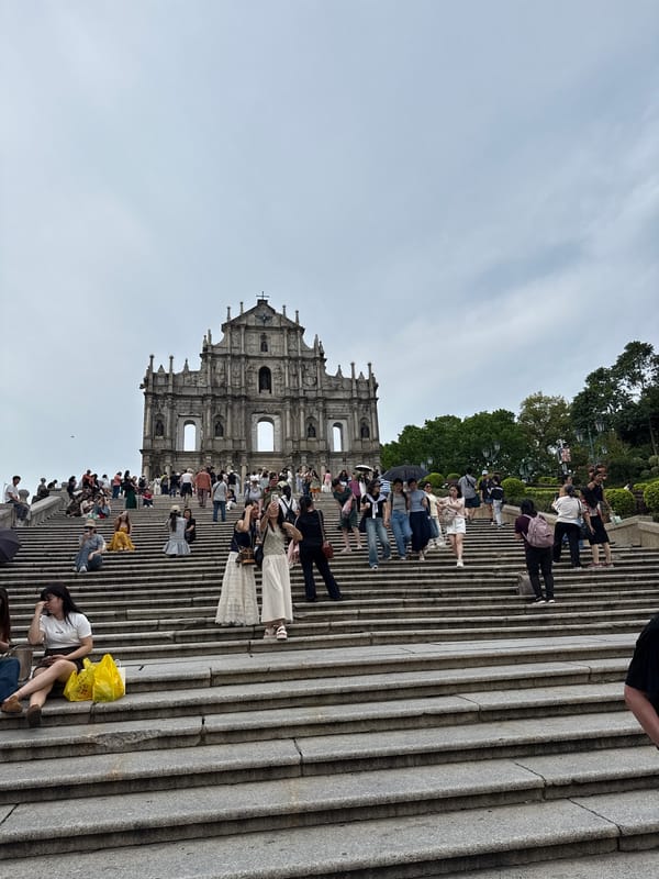Tourist crowds gather at historic St. Paul's Ruins in Macau