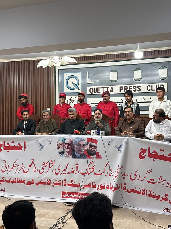 Press conference with protest banners at Quetta Press Club