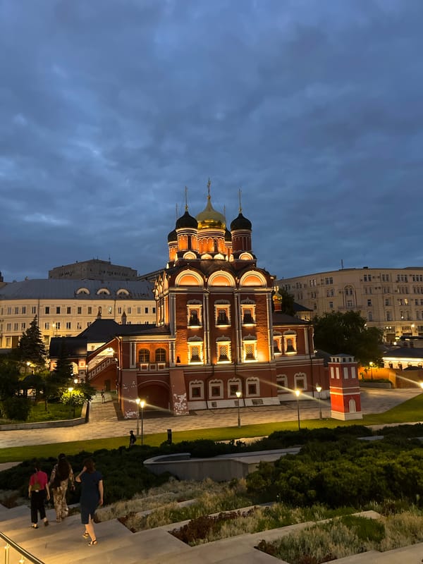 Moscow's Zaryadye district glows under a dramatic dusk sky