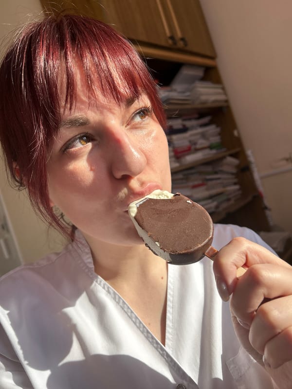 Woman enjoys chocolate ice cream in Foki, Russia