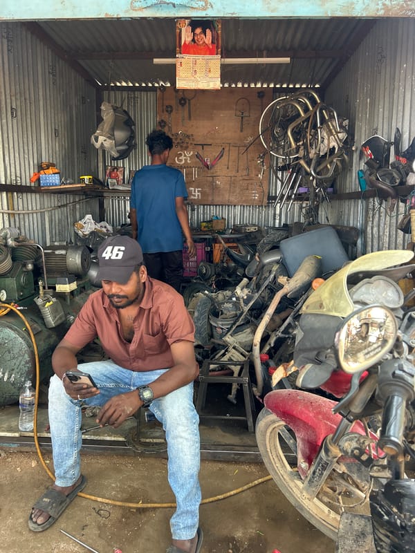 Motorcycle repair work documented in Puttaparthi workshop