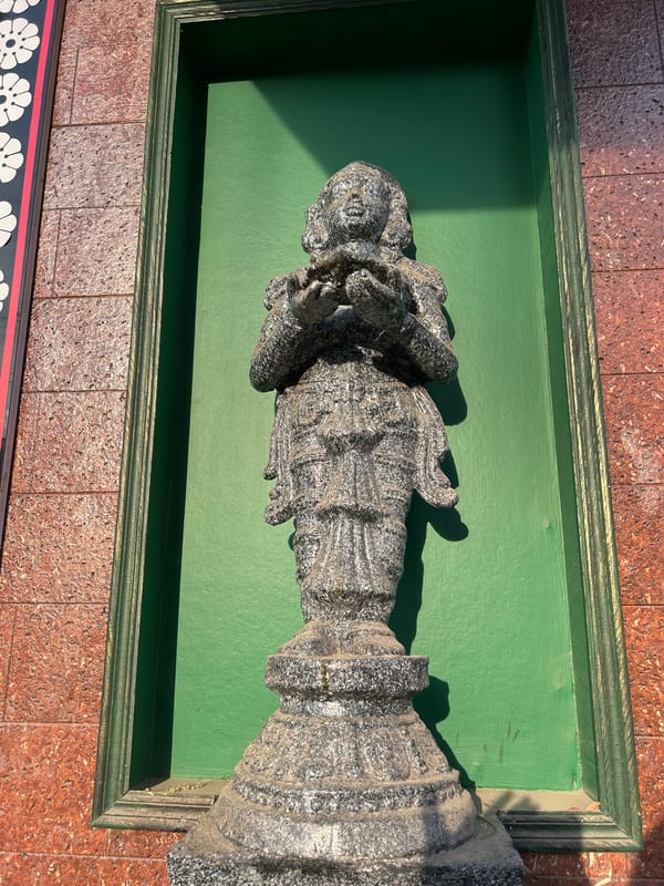 Religious sculptures and decorative archway documented in Puttaparthi