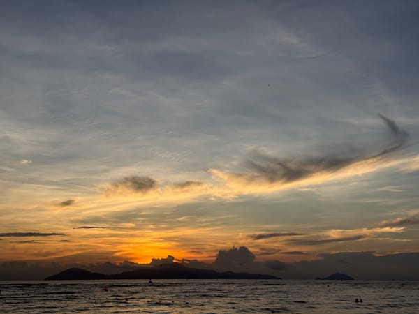 Hoi An sunset unfolds across sky and coastline