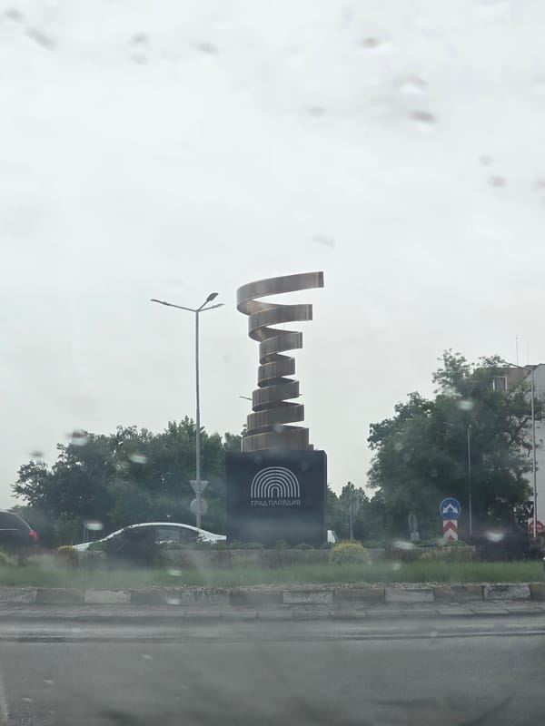 Modern metal sculpture spotted during rainy morning