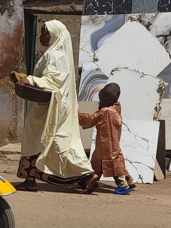 Daily life continues in Maiburiji, Nigeria marketplace and streets