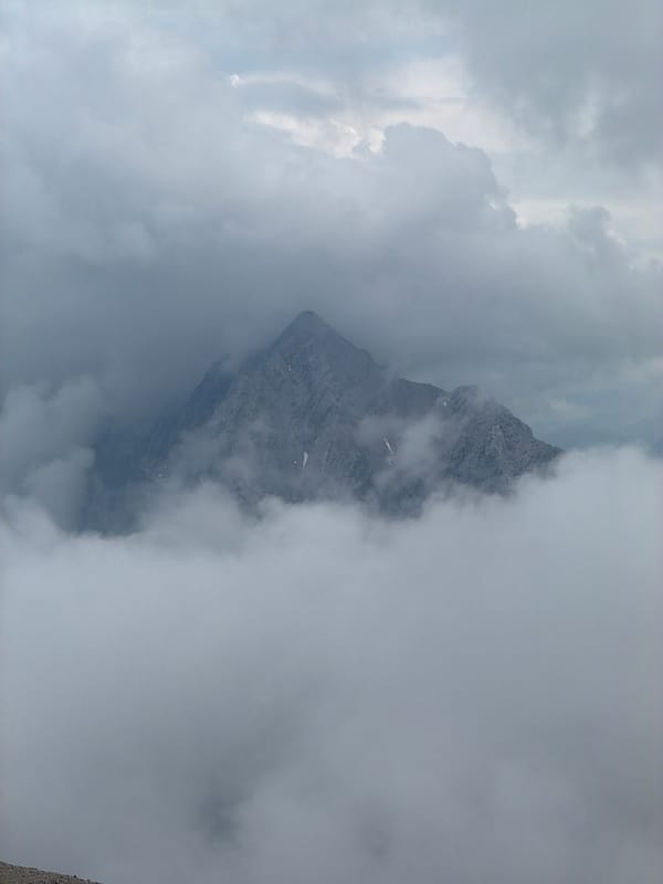 Zugspitze summit breaks through dense cloud cover
