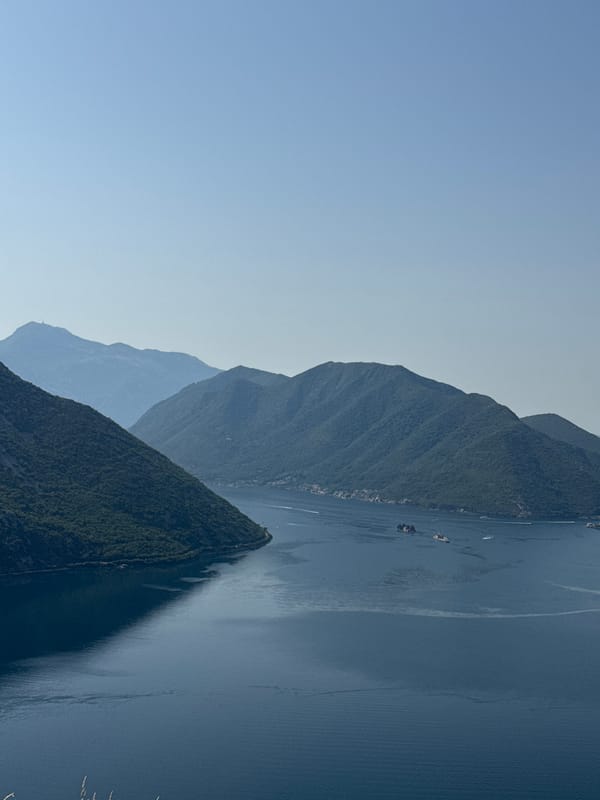 Bay of Kotor's mountains and water on a July morning
