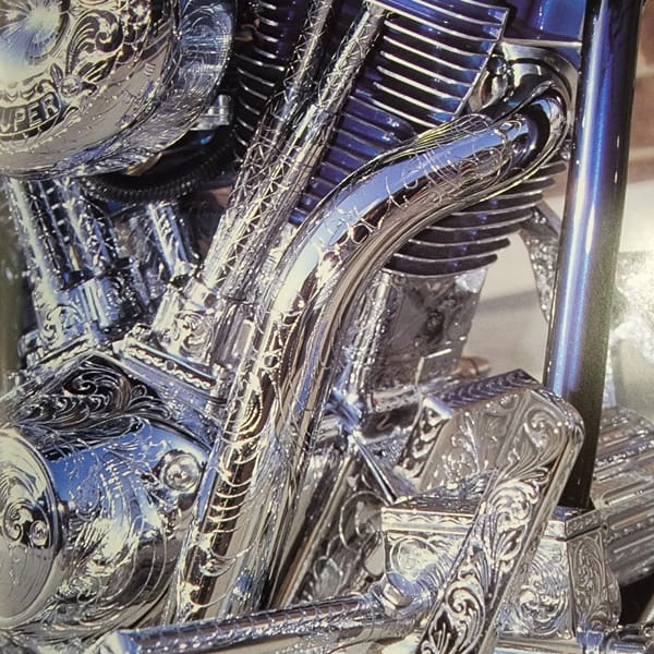 Close-up showcase of heavily customized motorcycles with chrome and custom paint