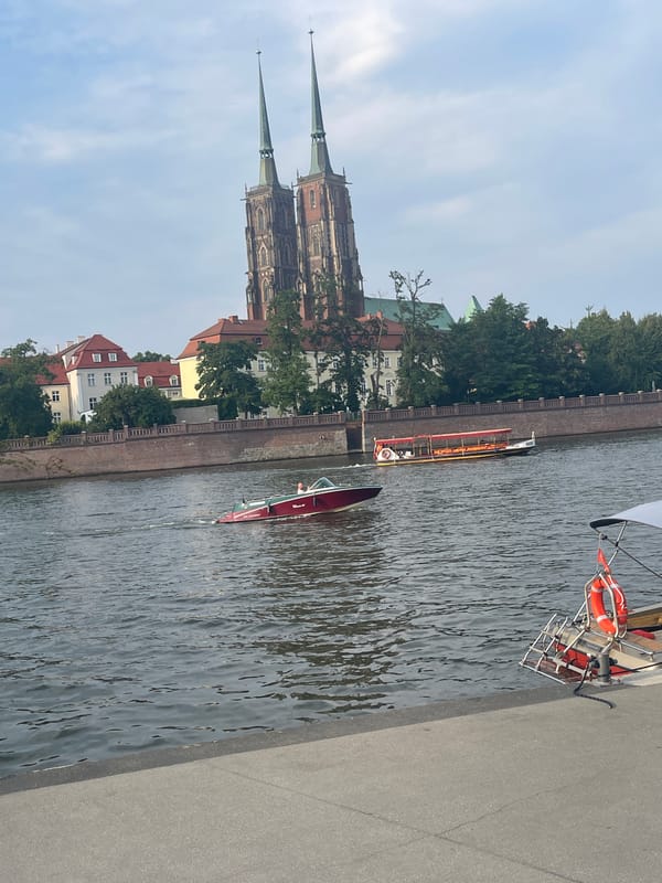 Wrocław's Oder River with cathedral skyline on a cloudy afternoon