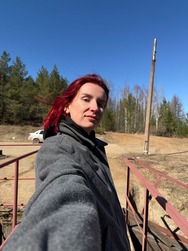 Woman observes dam and canal in Chernushka, Russia