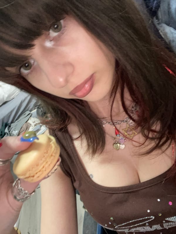 Woman enjoys macarons during afternoon outing in Ra'anana