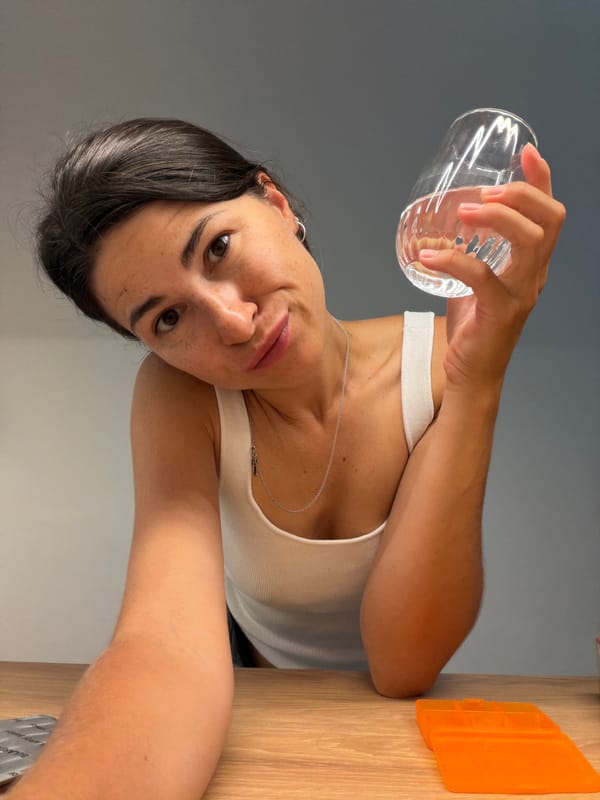 Woman photographed with cocktail bottles in Budva Montenegro evening session