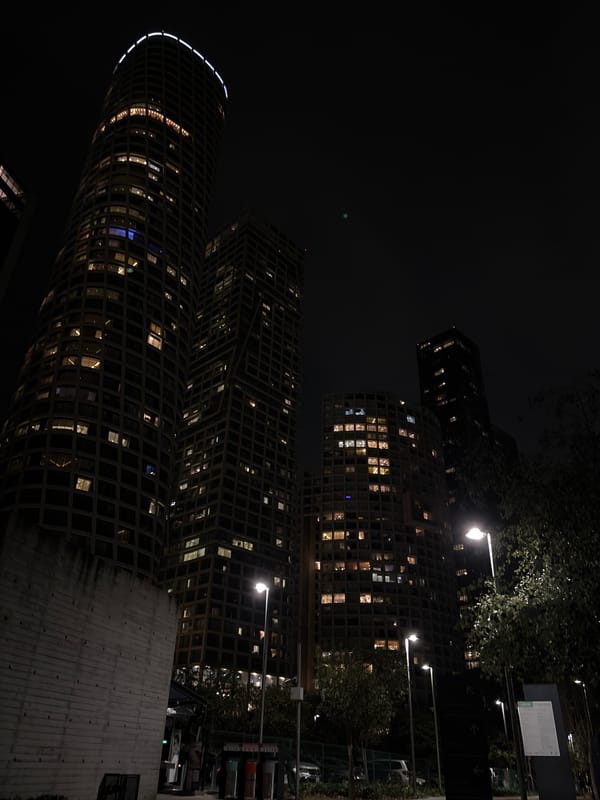 Nighttime urban high-rises captured in modern city scene