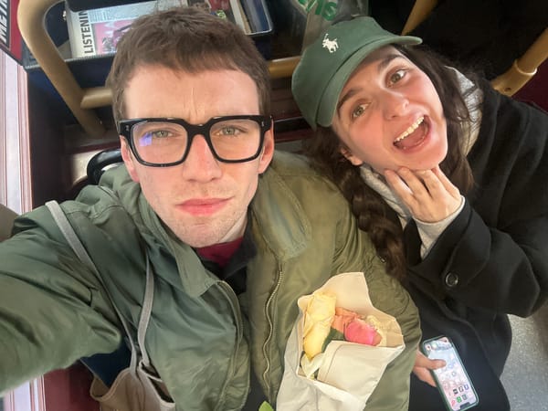 Dog rests under owner's feet on London Underground train