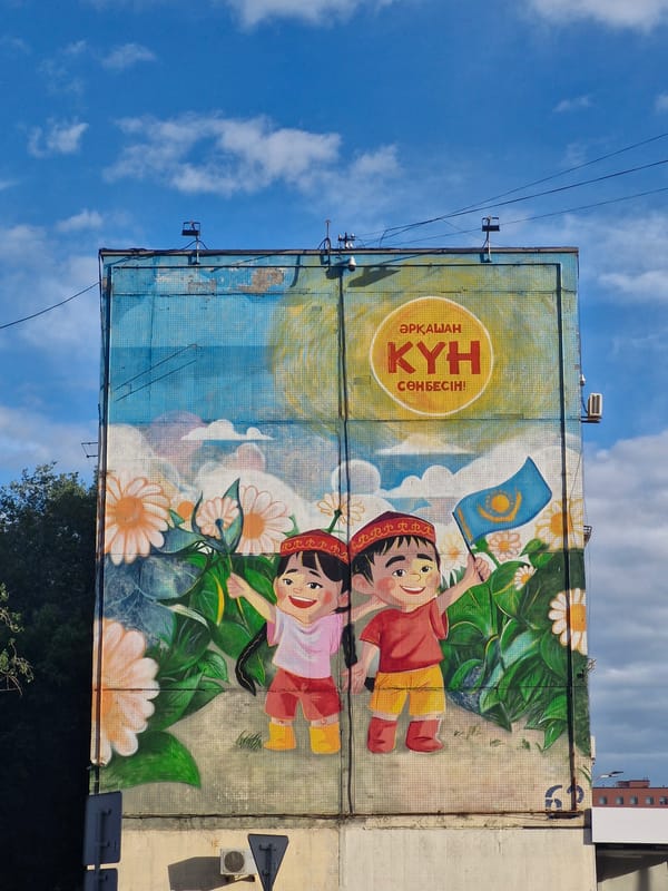 Geometric mural with Kazakh text documented in Astana