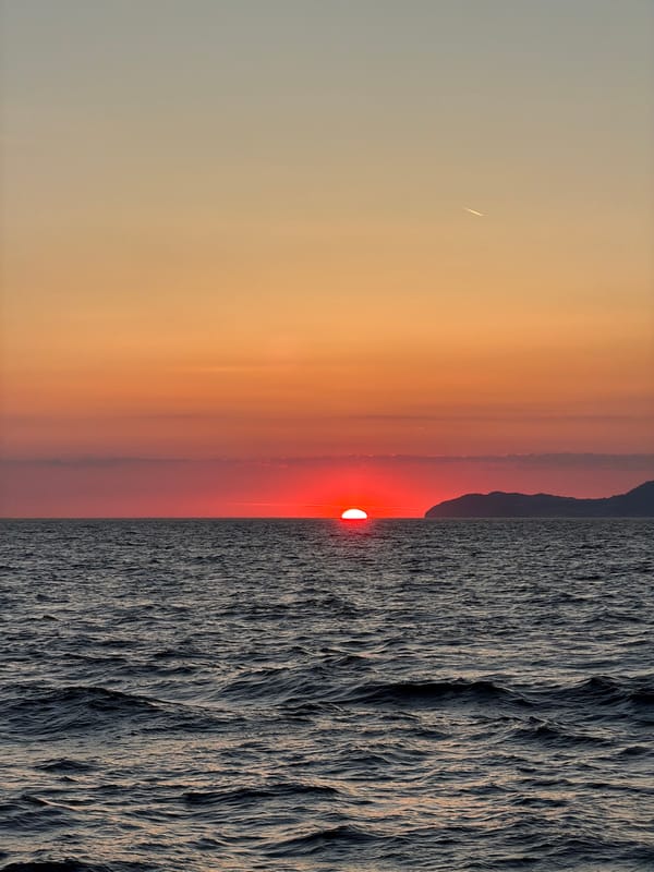 Sunset observed in Italy with unidentified linear object visible