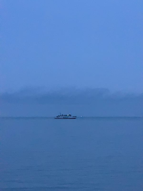 Ferry crossing in Thailand on a wet, overcast afternoon