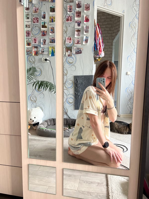 Woman documents personal moments with cat, flowers in Chaikovsky