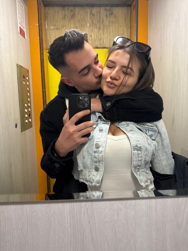 Two people captured in mirror reflection in Sofia