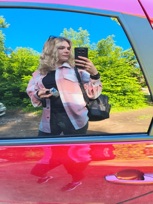Woman Takes Selfies with Red Car in Izhevsk